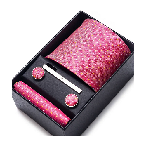 Pink patterned tie set with tie clip and cufflinks in a black box on a white background